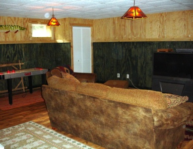 Den in new basement after remodeling by Harrelson's Home Improvement